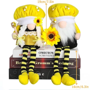 Pair of bumblebee garden gnomes with sunflowers and striped legs for home decor