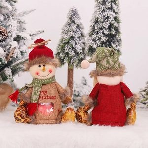 Christmas linen gift bags featuring snowman dolls with heart windows on snow background