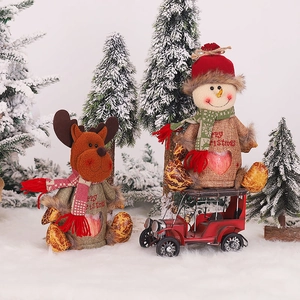 Christmas burlap gift bags with reindeer and snowman plush designs and heart windows