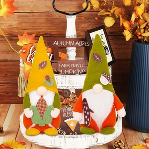 Autumn gnome plush set with maple leaf hats and harvest decor on tiered tray