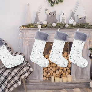 Set of 4 white Christmas stockings with silver tree branch patterns and grey faux fur trim
