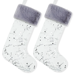 Detail of plush white Christmas stockings with silver glitter leaf patterns and grey faux fur