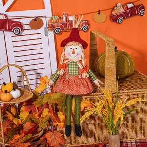 Macro detail of Thanksgiving scarecrow doll with autumn leaves and mini pumpkin decor