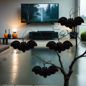 Detailed view of black felt bat pendant with orange stitching for Halloween decor