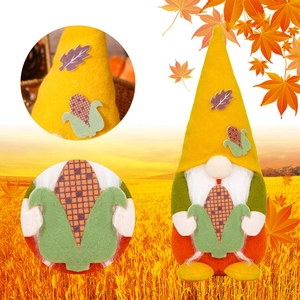 Close-up of fall gnome decor showing yellow hat details and corn accessory textures