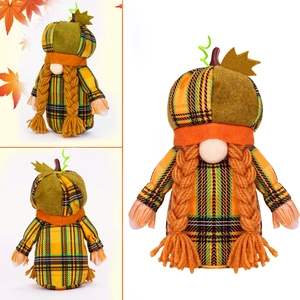 Detail of harvest gnome wearing pumpkin hat with orange braids and plaid fabric texture