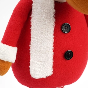 Detail of Christmas reindeer plush with red felt fabric and fuzzy white fur accents