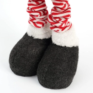 Detail of Christmas reindeer doll with grey felt boots and red striped knitted legs