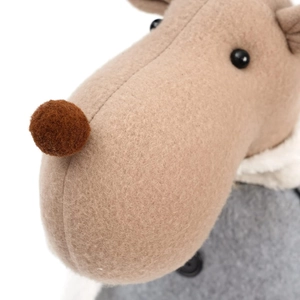 Close-up of reindeer doll featuring khaki felt texture, pom-pom nose and wool collar details