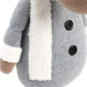 Detail of plush reindeer toy wearing a grey felt coat with buttons and white scarf