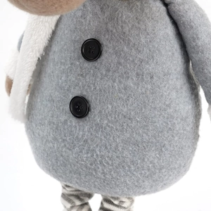 Detail of retractable reindeer plush toy featuring grey wool fabric and two black buttons