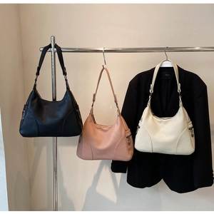 Hobo bags in black, dusty pink, and off-white with lychee grain leather and side zipper detail