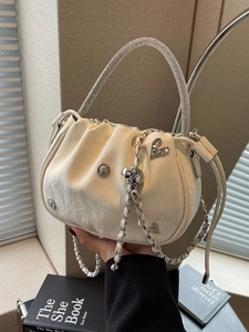 Elegant pleated ivory bucket bag with luxury rhinestone handle and chain strap