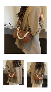 Close-up of caramel patent leather shoulder bag with pearl and silver heart chain detail