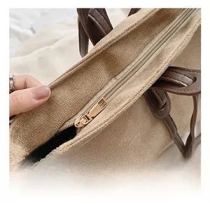 Detail of high-quality metal zipper closure on a large capacity textured tote bag
