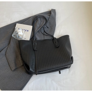 Minimalist black woven PU leather tote bag with large capacity and shoulder straps