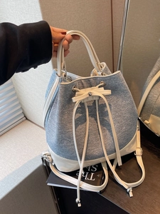 Contrast denim bucket bag with white leather trim and bow tie, large capacity backpack