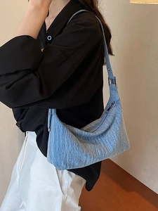 Blue denim hobo shoulder bag for women featuring a stylish vintage minimalist design