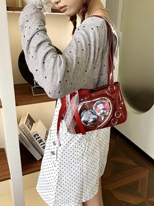 Red patent leather heart ita bag with clear window and metallic rivet detailing