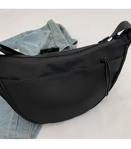 Macro detail of high-quality black nylon fabric with durable zipper and strap buckle