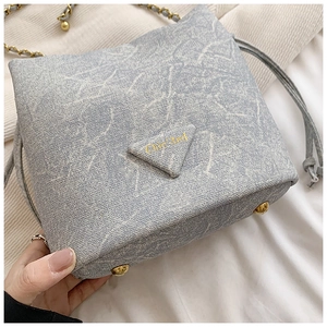 Detail of blue marble fabric bag with gold studs and Chic' 3nd embroidered logo