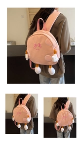 Detailed view of cute pink canvas backpack with embroidered smile and plush 3D limbs