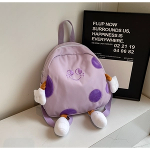 Detail of light purple mini canvas backpack with cute 3D cartoon limbs and embroidery