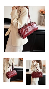 Detail of burgundy glossy leather bowling bag with silver metallic hardware and shoulder straps