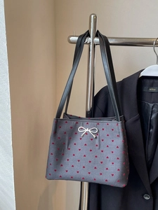 Dark grey canvas bucket bag with red heart embroidery and silver bow pendant charm