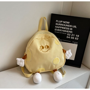 Close-up of yellow cartoon canvas backpack with cute 3D arms and legs detail