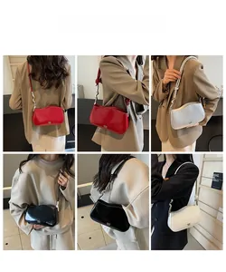 Detail view of wavy edge shoulder bags in various colors with metallic knot strap