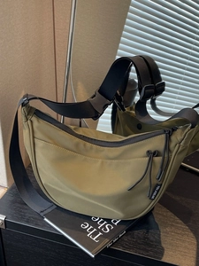 Olive green nylon half-moon crossbody bag with large capacity and adjustable strap
