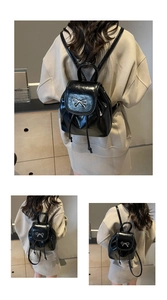 Mini black patent leather backpack with silver bow detail and slim shoulder straps