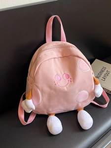 Cute pink canvas backpack with 3D plush limbs and embroidered smiling face for girls