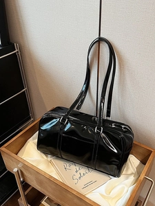 Vintage black patent leather Boston bag with high gloss finish and dual shoulder straps