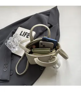 Interior view of off-white lychee texture bucket bag showing large storage capacity