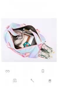 Internal view of blue-pink gradient travel bag showing spacious capacity for tech and gear