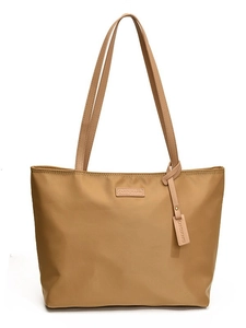Large khaki oxford cloth tote bag for women featuring long shoulder straps and brand tag