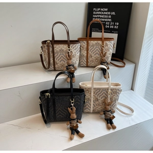 Set of four textured tote bags in various colors with cute rabbit charms and shoulder straps
