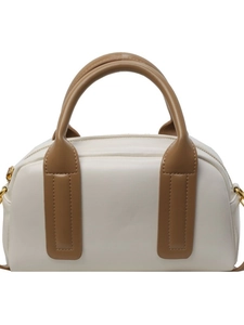 Elegant off-white Boston bag with brown contrast leather handles and gold-tone zippers