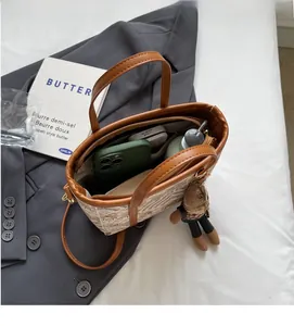 Top view of the spacious interior of a retro jacquard bucket bag with brown leather handles