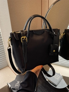 Large black Oxford cloth tote bag with double handles and adjustable gold-tone strap