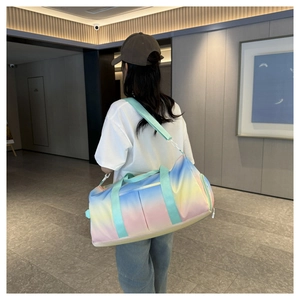 Detail of macaron gradient travel bag with mint green straps and waterproof fabric texture
