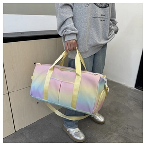 Detail of macaron gradient travel bag showing the high-density nylon texture and sturdy handles