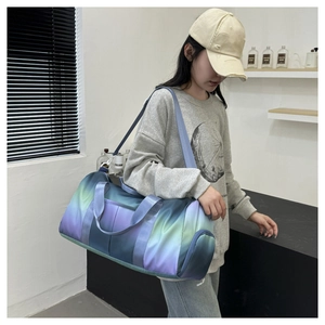 Modern gradient travel bag shown with detachable strap in a minimalist indoor setting