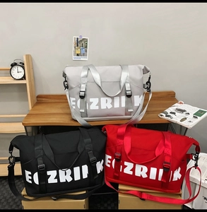 Detailed comparison of grey, black and red large oxford travel bags with shoulder straps