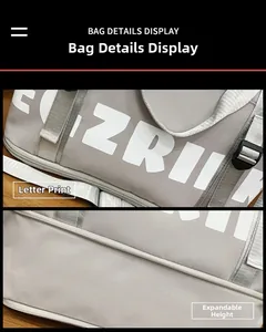 Detail view of large grey oxford travel bag showing white letter print and expandable zipper