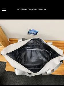 Internal view of the large capacity grey oxford fabric travel bag showing black waterproof lining