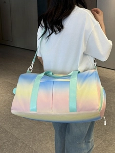 Large macaron gradient travel bag with adjustable strap shown worn by a female model