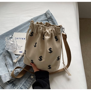 Sac seau chic en toile beige avec broderie signe dollar et bandoulière marron café